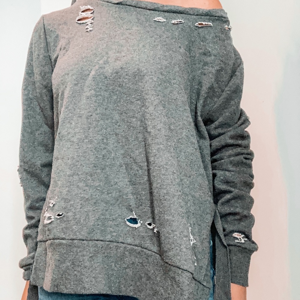 Ripped grey sweatshirt